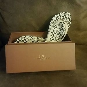 White and black coach flip-flops